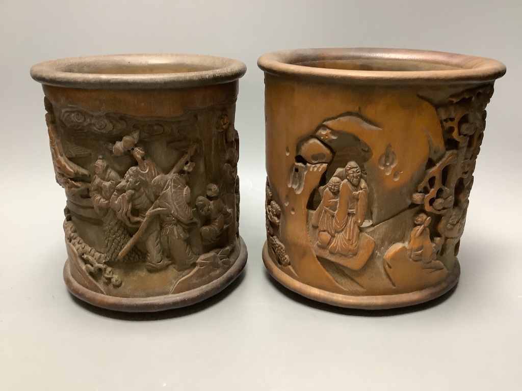 An assortment of Chinese carved bamboo and wood brush pots, tallest 17cm (8)